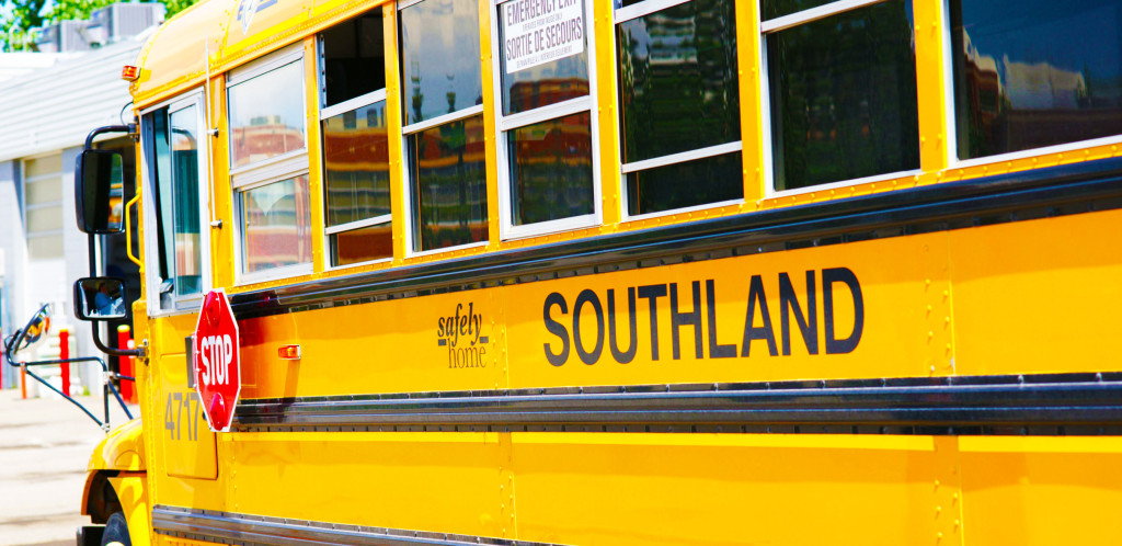 Photo of the side of a yellow bus.  Reads: "Safely home" and "Southland"